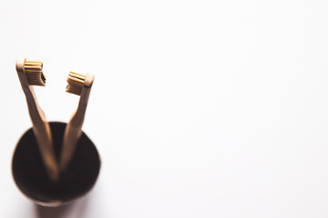 Wooden bamboo toothbrushes on white background isolated. The concept of zero waste, recycling