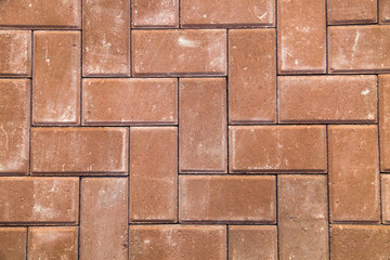 Red paving slabs in the form of paving Stones or Bricks. Construction, backgrounds, interior.