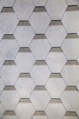 Flexible tiles of gray color with a hexagonal shape. Construction, background, textures, design.