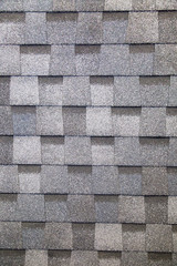 Tile is a multi-layer flexible gray rectangular shape. Construction, background, textures, design.