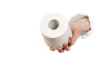 Hand delivers toilet paper through hole in the wall