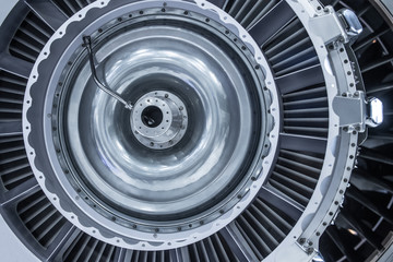 Turbine Engine. Aviation Technologies. Aircraft jet engine detail during maintenance. Blue toned.