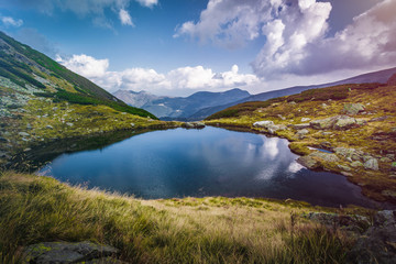 Fototapeta na wymiar Lake landscape in the mountains, breathtaking view