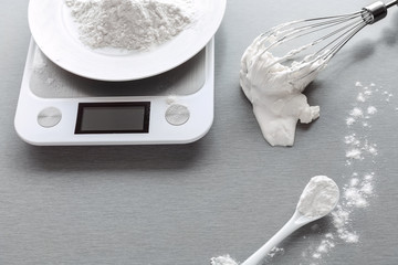 kitchen weights measure the mass of flour for making biscuit