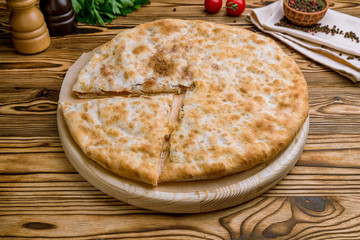 khachapuri with beans on wooden table