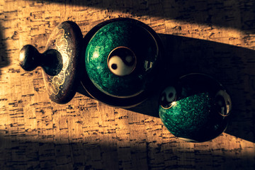 Close-up of a Chinese yin yang balls,  harmony of the world and the universe, Qigong balls with yin yang symbol - obrazy, fototapety, plakaty