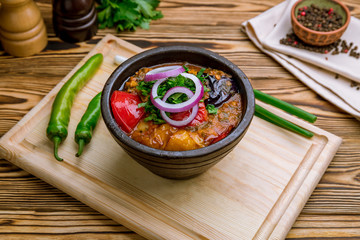 chanakhi Georgian Cuisine on wooden table © Алиса Королевская