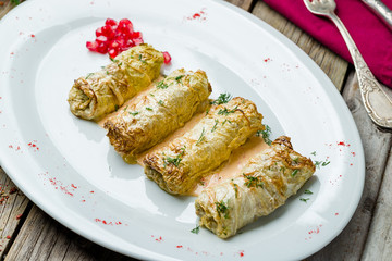 Stuffed cabbage on wooden table