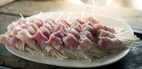 Special barbeque with pork and mushroom on a white dish. easy cooking. homemade. raw