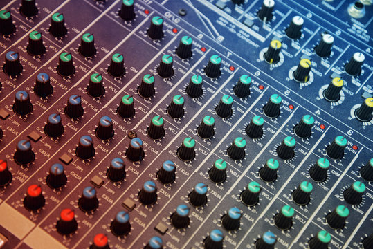 Controllers on professional audio mix pult. Professional DJ sound mixer.