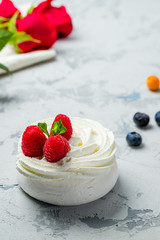 dessert Anna Pavlova with raspberries