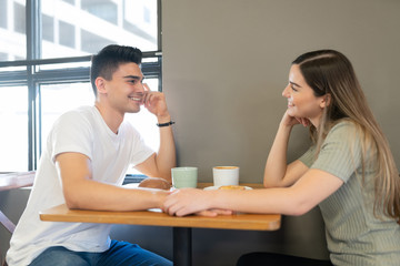 Cute couple dating in a restaurant