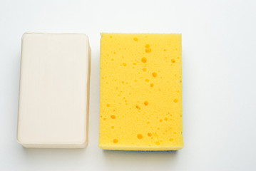 white soap yellow sponge isolated on a white background
