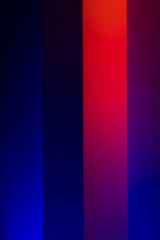 Fototapeta premium Gradient lines on the wall in blue, red, purple, orange colors