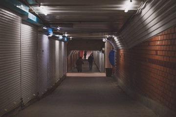 old poorly lit underpass made of brick.
