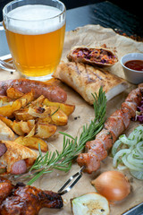 summer grilled snacks with a glass of light beer