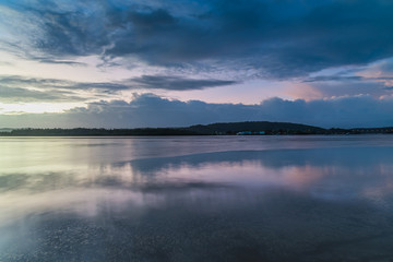 Obraz na płótnie Canvas After the Rain - Sunrise by the Bay
