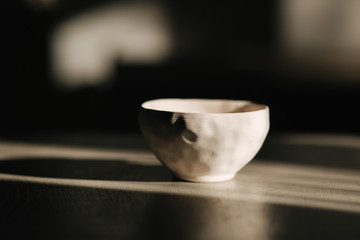 Ceramic cup for tea or coffee on the table