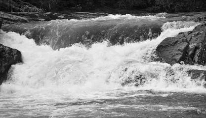 A waterfall with splashing water (black and white)