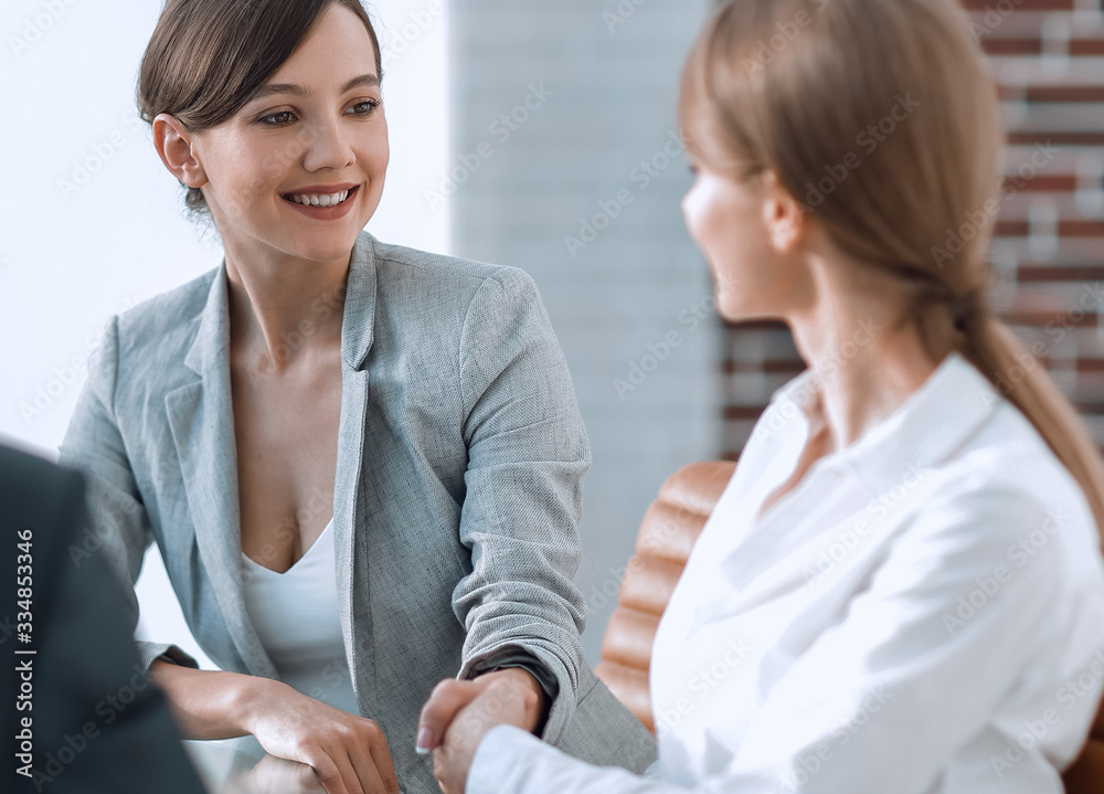 Canvas Prints handshake of a Manager, and a client sitting behind a Desk