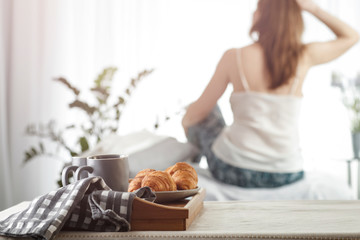 Woman at the window on a beautiful sunny day