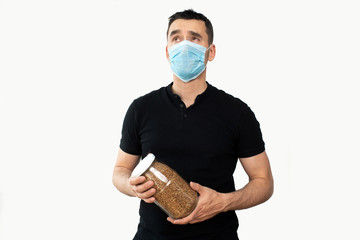 a man wearing a respiratory mask to protect against airborne respiratory diseases such as flu,...