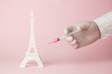 Fototapeta na wymiar Eiffel Tower vaccination abstract. France fighting against covid-19 virus.