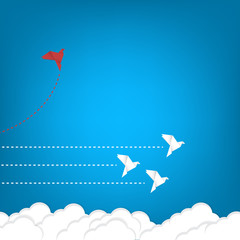 Think differently concept. Be different. Red bird changing direction. New idea, change, trend, courage, creative solution, innovation and unique way concept	