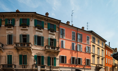 Fototapeta na wymiar Bright and colorful Italian cityscape. Sunlit streets. Colorful houses. Warm and comfortable.