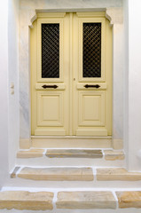 Obraz na płótnie Canvas Colored door of a traditional Greek house in Parikia, the capital of Paros island in Greece