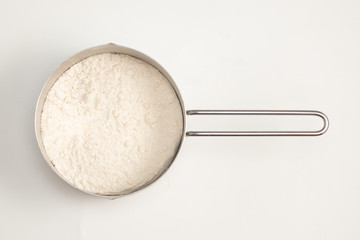 Fototapeta na wymiar Half Cup of wheat flour