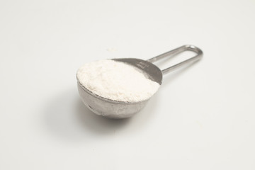 Tablespoon of wheat flour - obrazy, fototapety, plakaty