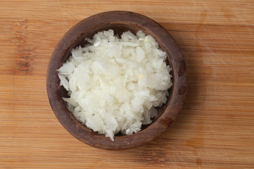 Chopped Onion in a wooden bowl