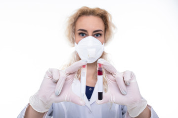 The doctor holds in his hands double tubes with blood against white background