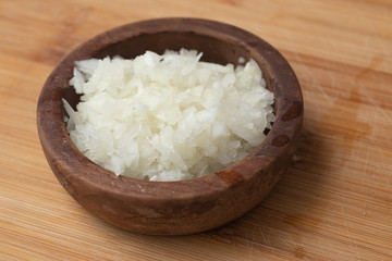 Chopped Onion in a wooden bowl