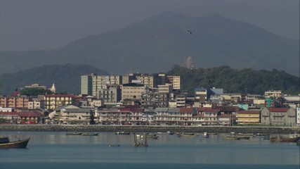 Wide Panorama view of the Old Town of Panama City, Plaza de Francia, the presidency of the republic, and walled fort, with the modern metropolis Panama City in the background