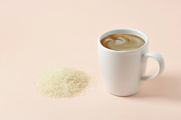 Cappuccino with rice milk milk foam. The concept of products for a healthy diet. An alternative to cow's milk. Light background Close-up. Free space for text.