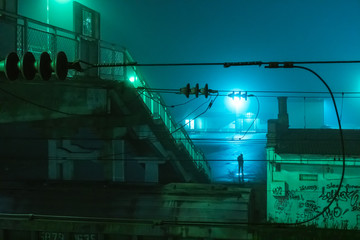  lonely silhouette at the train station in the night