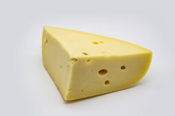 Delicious fresh hard cheese on a white background. Healty and very tasty cheese.