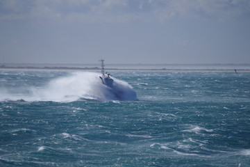 Tug during bad weather at sea / storm