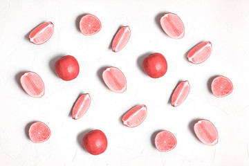 Sliced lime in red. Colored fruit background.