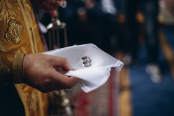 man hand holding a gift box with engagement ring