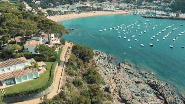 Spain Costa Brava Mediterranean coastline panning from the sea shore, Canyelles Grosses, Roses, Catalonia