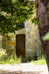 An old door in a stone wall in the Park.