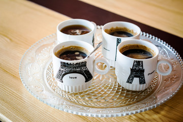 cup of coffee and cake on table