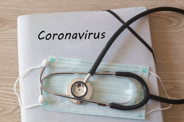 File with coronavirus written on it, medical, mask and stethoscope