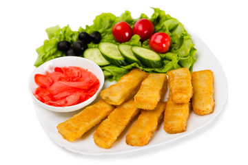 Grilled fish fingers with vegetables