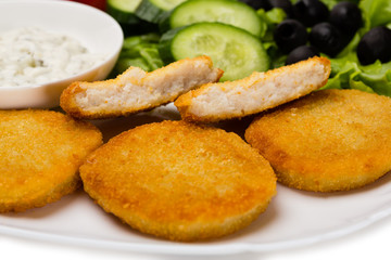 Grilled fish cutlet with vegetables
