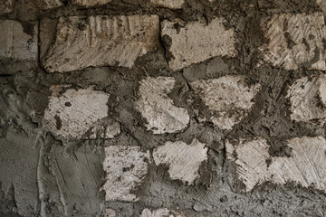Repair and construction. The old wall. Wall of brick, stone and concrete. Stone and cement background