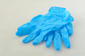 Blue rubber medical gloves and antiseptic. Protection of hands from infection during a pandemic.